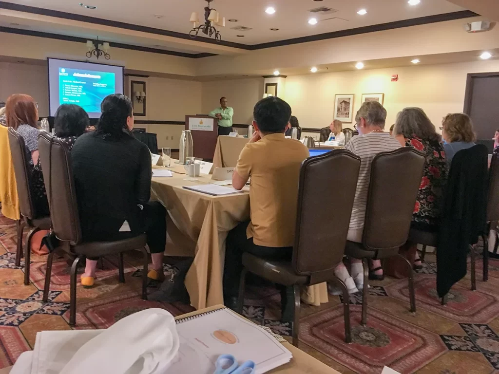 BBDI attendees listening to a presentation at an annual workshop.